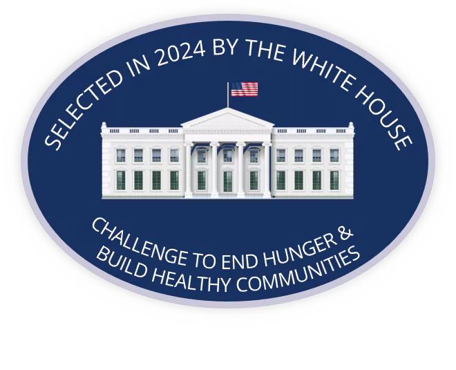 The white house depicted in an oval seal, surrounded by the words "Selected in 2024 by the White House Challenge to End Hunger & Build Healthy Communities"